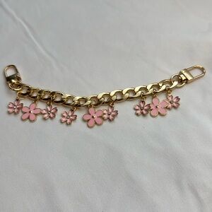 Pink and gold bag charm